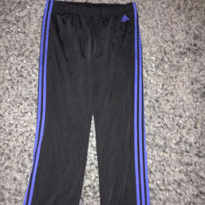 blue and black Adidas pants